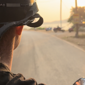 Shot from the back of a scooter in Goa at sunset